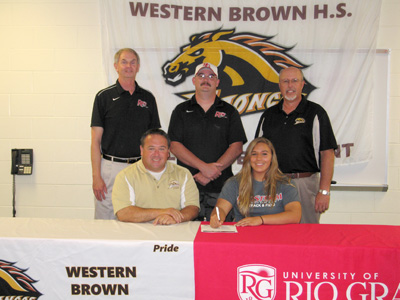Western Brown's Lauren Stacy is joined by her father and her coaches for a photo after signing with Rio Grande